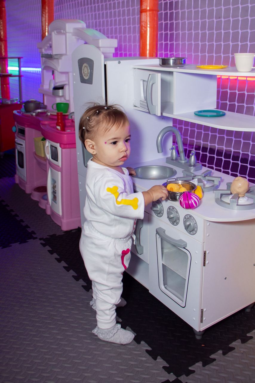 colorful children playground with ball pit and soft climbing obstacles in a bright indoor setting
